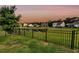 Backyard view with wrought iron fence and view of neighborhood at 3431 Great Egret Dr, Johns Island, SC 29455