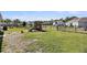 Large backyard with a playset and plenty of space for outdoor activities at 3431 Great Egret Dr, Johns Island, SC 29455