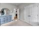 Bedroom with blue dresser, carpeted floor, and a view into the hallway at 3431 Great Egret Dr, Johns Island, SC 29455
