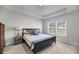 A serene bedroom featuring a tray ceiling, neutral walls, two windows, and a comfortable, well-lit space at 3431 Great Egret Dr, Johns Island, SC 29455