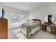 Bright bedroom with carpet and window, wooden bed, and matching vanity at 3431 Great Egret Dr, Johns Island, SC 29455