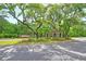 Picturesque Saint John's Lake entrance showcasing brick architecture and beautiful landscaping at 3431 Great Egret Dr, Johns Island, SC 29455