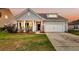 Charming single-Gathering home with a well-manicured lawn, attached garage, and inviting front porch at 3431 Great Egret Dr, Johns Island, SC 29455