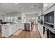 Bright kitchen with stainless steel appliances, white cabinets, and white countertops at 3431 Great Egret Dr, Johns Island, SC 29455