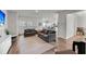 Open living area featuring hardwood floors, large windows, neutral paint, and modern furnishings at 3431 Great Egret Dr, Johns Island, SC 29455