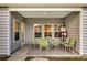 Covered patio with a table and chairs, perfect for outdoor dining and relaxation at 3431 Great Egret Dr, Johns Island, SC 29455