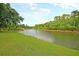 Scenic view of a wide river winding through lush green forests with tall trees and sky at 3431 Great Egret Dr, Johns Island, SC 29455