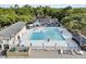 Expansive pool area with multiple seating and lounge areas, surrounded by trees at 356 Hobcaw Dr, Mount Pleasant, SC 29464