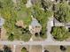 An aerial view showing the property's roof, yard, and nearby streets surrounded by trees at 356 Hobcaw Dr, Mount Pleasant, SC 29464