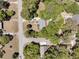 An aerial view showing the property's roof, yard, and nearby streets surrounded by trees at 356 Hobcaw Dr, Mount Pleasant, SC 29464