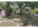 Lush backyard featuring a swing set, mature trees, a well-maintained lawn, and a charming privacy fence at 356 Hobcaw Dr, Mount Pleasant, SC 29464