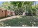 Spacious backyard featuring a covered patio, shed, privacy fence, and lush greenery, perfect for outdoor living at 356 Hobcaw Dr, Mount Pleasant, SC 29464