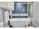 Elegant bathroom with a modern soaking tub, blue tiled accent wall and stylish decor at 356 Hobcaw Dr, Mount Pleasant, SC 29464