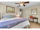Cozy bedroom with a queen-sized bed, soft lighting, tasteful artwork, and hardwood floors at 356 Hobcaw Dr, Mount Pleasant, SC 29464