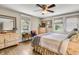 Bright bedroom with hardwood floors, dresser and natural light from large windows at 356 Hobcaw Dr, Mount Pleasant, SC 29464