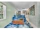 Comfortable living room with a cozy blue sofa, decorative rug and a bright sunny window at 356 Hobcaw Dr, Mount Pleasant, SC 29464
