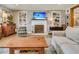 Inviting living room featuring a brick fireplace, built-in shelving, and comfortable seating, perfect for relaxing and entertaining at 356 Hobcaw Dr, Mount Pleasant, SC 29464