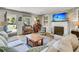 Cozy living room features a brick fireplace, built-in shelving, and comfortable seating, creating a warm and inviting space at 356 Hobcaw Dr, Mount Pleasant, SC 29464