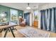 Inviting office features a wooden desk, comfortable leather chair, and abundant natural light from the windows at 356 Hobcaw Dr, Mount Pleasant, SC 29464