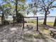 A playground with swings, picnic tables, and a pier over the water at 356 Hobcaw Dr, Mount Pleasant, SC 29464