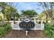 Entrance to Hobcaw Yacht Club with lush greenery and a glimpse of the clubhouse at 356 Hobcaw Dr, Mount Pleasant, SC 29464