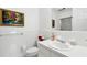Bathroom featuring a white sink, mirror, toilet and a tiled shower at 39 N Adgers Wharf, Charleston, SC 29401