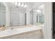 Bright bathroom with a clean, white aesthetic and a mirrored wall at 39 N Adgers Wharf, Charleston, SC 29401