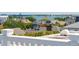 A picturesque cityscape showing city homes, foliage and ocean views from rooftop at 39 N Adgers Wharf, Charleston, SC 29401