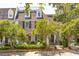 Charming brick home with dormer windows, mature trees, and an inviting entrance at 39 N Adgers Wharf, Charleston, SC 29401
