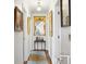 Hallway with an antique mirror, wooden floors, and lots of natural light at 39 N Adgers Wharf, Charleston, SC 29401