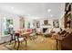 Cozy living room featuring a fireplace, built-in bookshelves, and ample seating at 39 N Adgers Wharf, Charleston, SC 29401