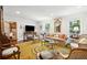 Comfortable living area with a television, plush seating, and elegant accents at 39 N Adgers Wharf, Charleston, SC 29401