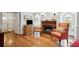 Open living room with hardwood floors, fireplace, and natural light from windows at 39 N Adgers Wharf, Charleston, SC 29401