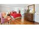 Main bedroom with wood floors and a peek into the ensuite bathroom at 39 N Adgers Wharf, Charleston, SC 29401