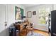 A home office featuring a wood desk, hardwood floors and natural light at 39 N Adgers Wharf, Charleston, SC 29401