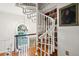 Hallway with a beautiful, winding staircase, chandelier and view from window at 39 N Adgers Wharf, Charleston, SC 29401
