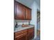Elegant bar area featuring granite countertops and wooden cabinetry at 411 Black Horse Rd, Moncks Corner, SC 29461