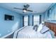 Comfortable bedroom with dark wood floors, ceiling fan, and a large window at 411 Black Horse Rd, Moncks Corner, SC 29461