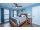 Comfortable bedroom with dark wood floors, ceiling fan, and a large window at 411 Black Horse Rd, Moncks Corner, SC 29461