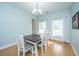 Bright dining room featuring hardwood floors and a modern chandelier at 411 Black Horse Rd, Moncks Corner, SC 29461