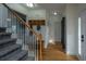 Inviting foyer with wood floors, coat rack, and staircase at 411 Black Horse Rd, Moncks Corner, SC 29461