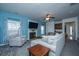 Cozy living room with fireplace, plush seating, and lots of light at 411 Black Horse Rd, Moncks Corner, SC 29461