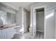 Bathroom vanity featuring a large mirror and wood-look flooring at 414 Courtland Dr, Summerville, SC 29486
