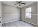 Cozy bedroom with a ceiling fan, natural light from the window, and modern flooring at 414 Courtland Dr, Summerville, SC 29486
