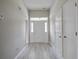 Entrance hallway with gray walls, a front door with sidelights, and multiple doorways at 414 Courtland Dr, Summerville, SC 29486