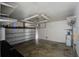 Spacious garage with ample lighting, storage racks and a water heater at 414 Courtland Dr, Summerville, SC 29486