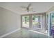 Sunroom featuring tile flooring, neutral paint, and a view of the yard through the large windows at 414 Courtland Dr, Summerville, SC 29486