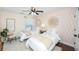 Cozy bedroom featuring twin beds, decorative mirrors, and a bright window at 4906 W Liberty Park Cir, North Charleston, SC 29405
