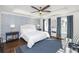 Spacious main bedroom features a tray ceiling, an accent wall, and large windows with bright light at 4906 W Liberty Park Cir, North Charleston, SC 29405