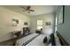 Bright bedroom featuring a king-sized bed, desk, neutral walls, and lots of natural light at 4911 Chisolm Rd, Johns Island, SC 29455